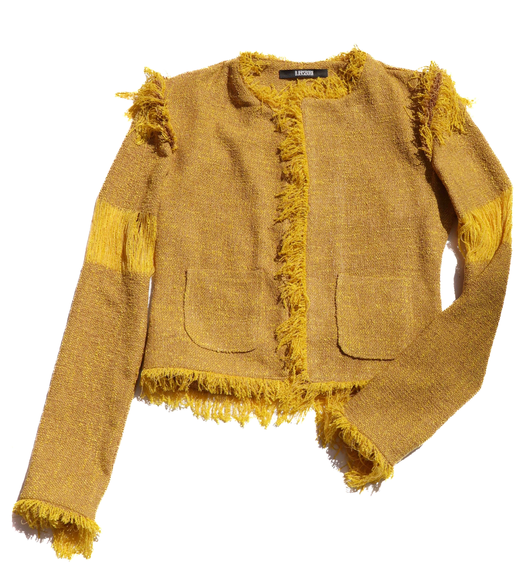 Yellow tweed jacket with frayed edges on a white background